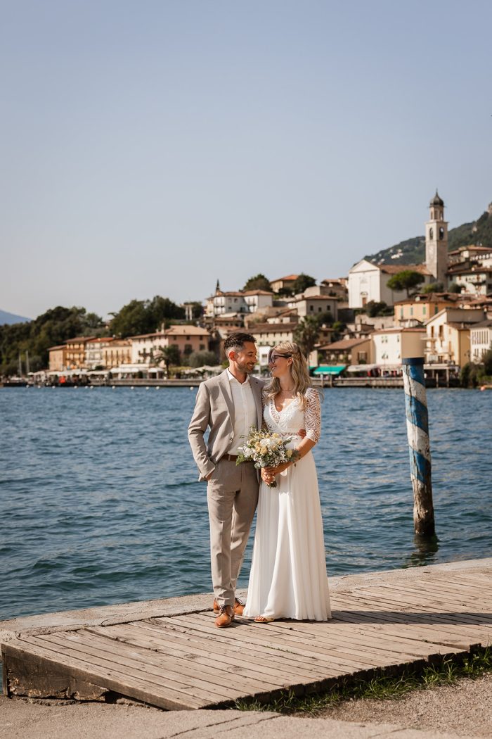 Romantic wedding couple in Limone sul Garda on the lakefront &ndash; bride and groom from Germany photographed during an intimate Lake Garda elopement.