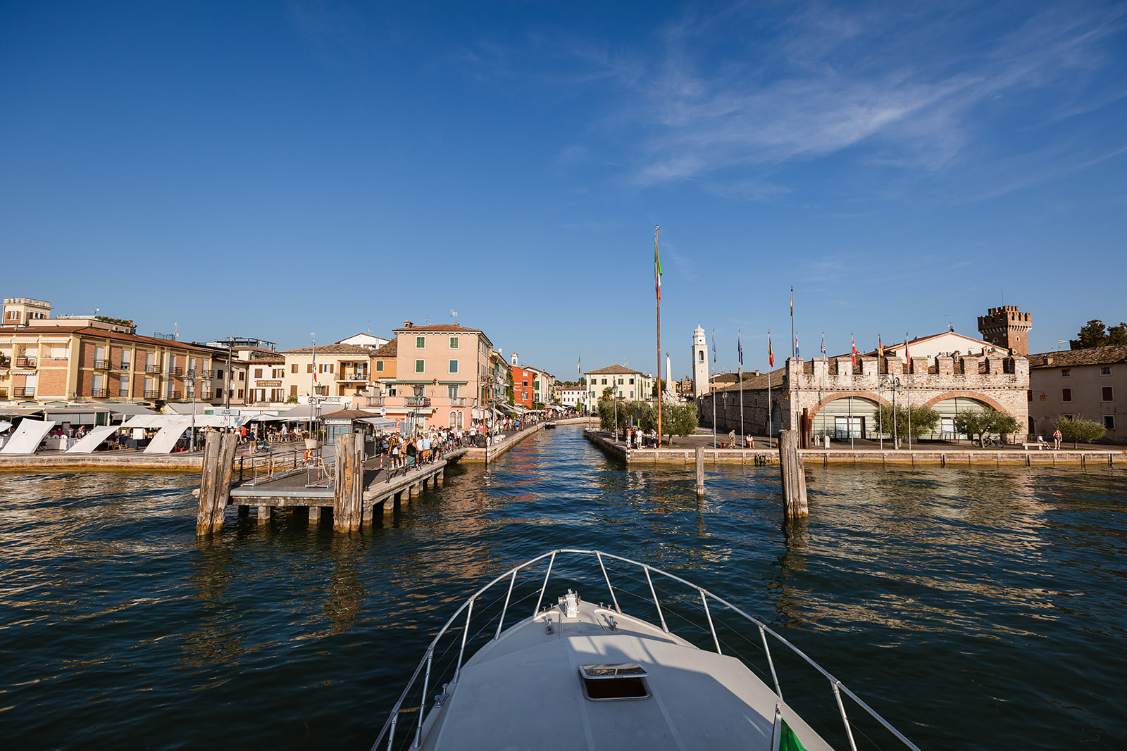 Arrival by boat at Lazise port after a wedding ceremony at Castello di Malcesine on Lake Garda