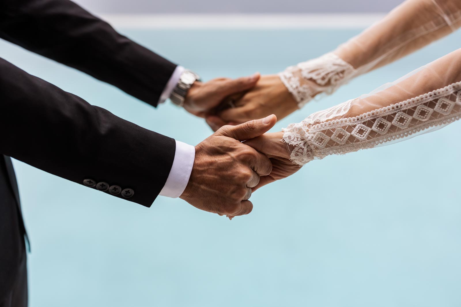 Close-up of a couple holding hands during a Lake Garda elopement at EALA in Limone sul Garda